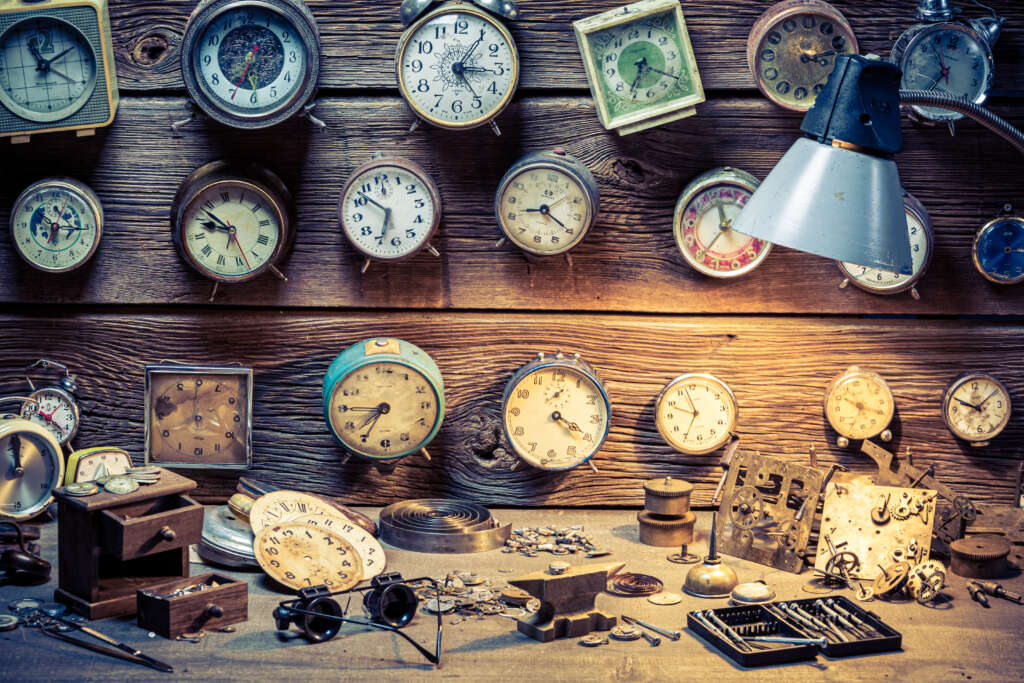 Clocks on a wall in a clock makers as part of an article on future proofing yourself by spending just 30 minutes of your day exercising.