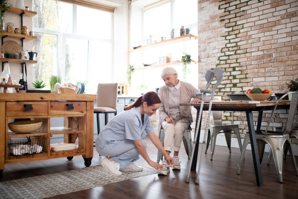 older lady receiving physiotherapy at home for foot related msk condition 
