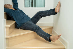 person falling down the stairs after slipping